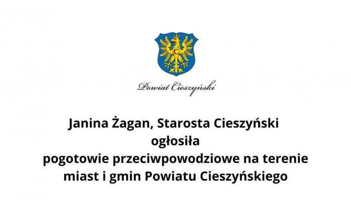 Herb Powiatu Cieszyńskiego i napis „Janina Żagan, Starosta Cieszyński ogłosiła pogotowie przeciwpowodziowe na terenie miast i gmin Powiatu Cieszyńskiego.” Komunikat informuje o podjętych działaniach w związku z zagrożeniem powodziowym.